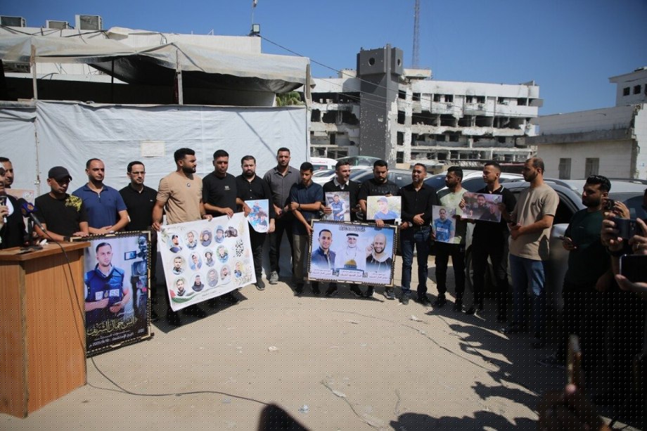 Journalists hold a vigil outside an Al Jazeera tent in Gaza City on the anniversary of the assassination of journalist and correspondent Anas Al-Sharif