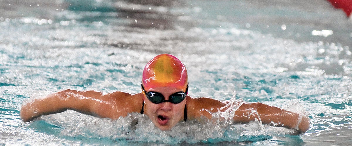 Packers close out another close call in home swim dual