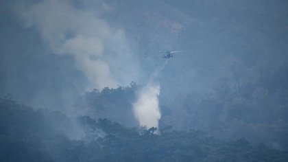 Bushfire could 'run again' amid dry conditions