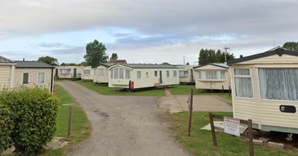 Body found near caravan site as police arrest four people over 'murder'
