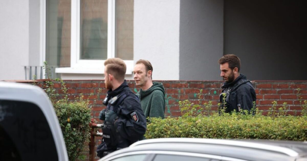 Madeleine McCann suspect Christian Brueckner smirks as he's led from safe house by police