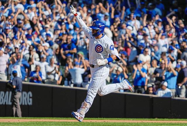 Back-to-back homers lift Cubs past Padres in wild-card series opener