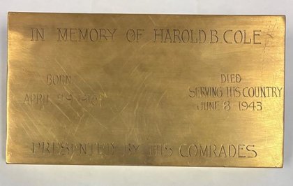 Who’s the owner of this memorial plaque for a World War II veteran that was found on the side of the road in Central NY?