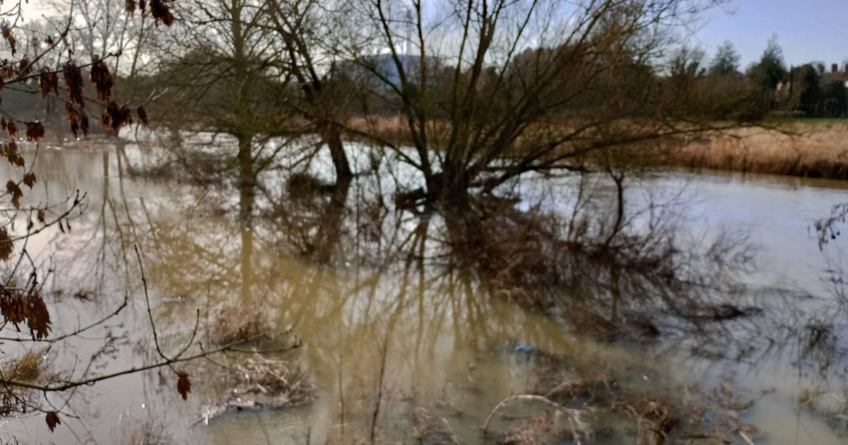 River bursts its banks and floods following heavy rainfall