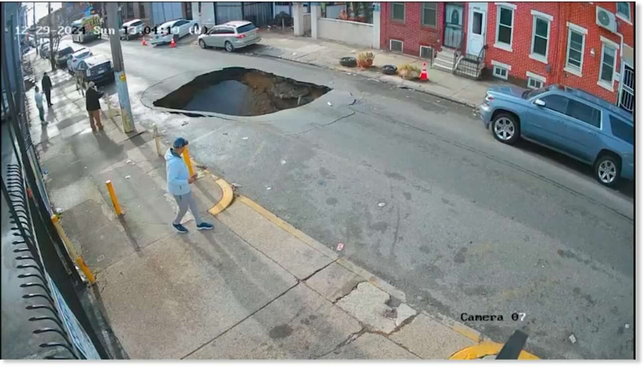 Videos show large sinkhole opening up on a Philadelphia street on December 23rd, 2024