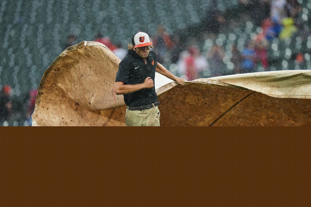 Phillies rout Orioles 8-0 in a game called by rain after 5 1/2 innings