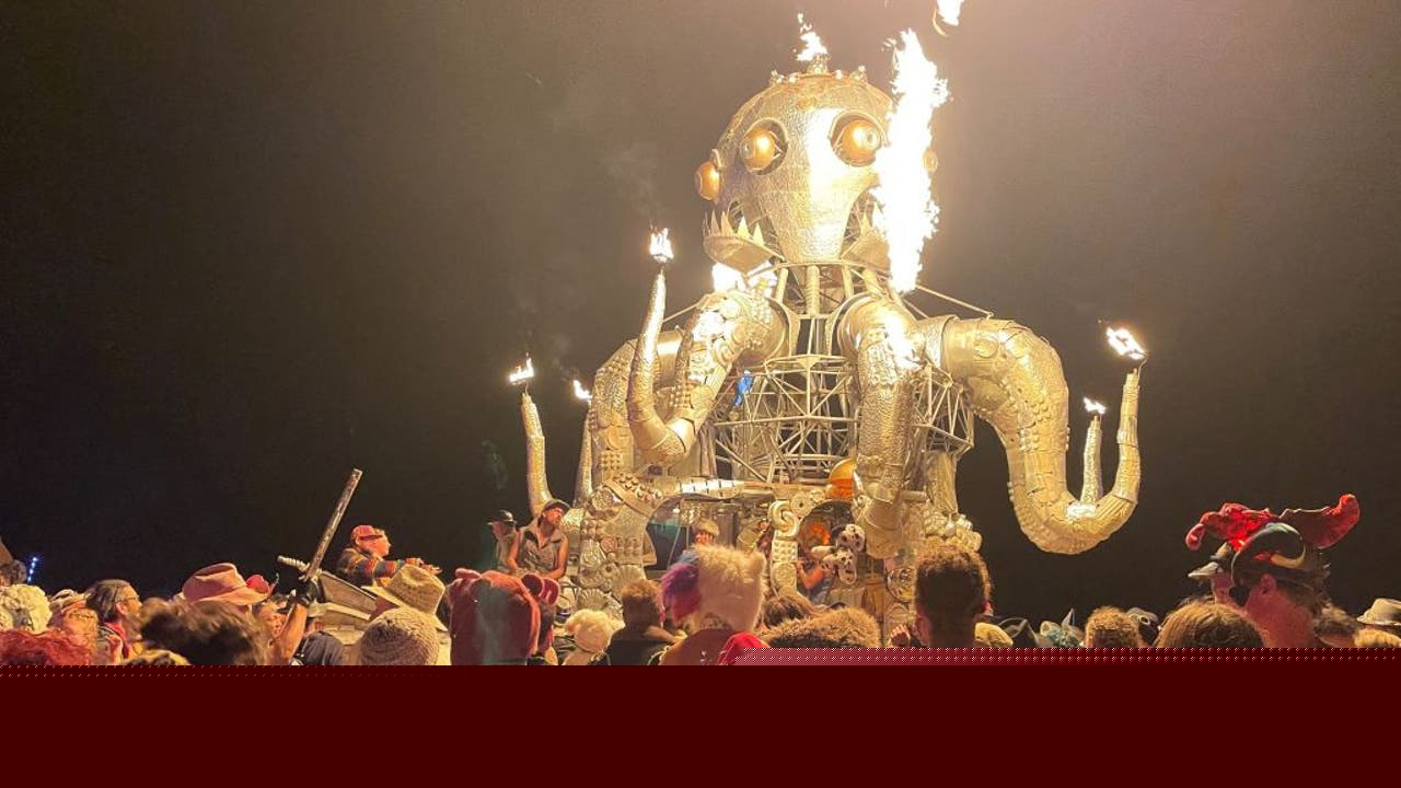 What other strange events are reportedly happening at Burning Man as police hunt a killer?