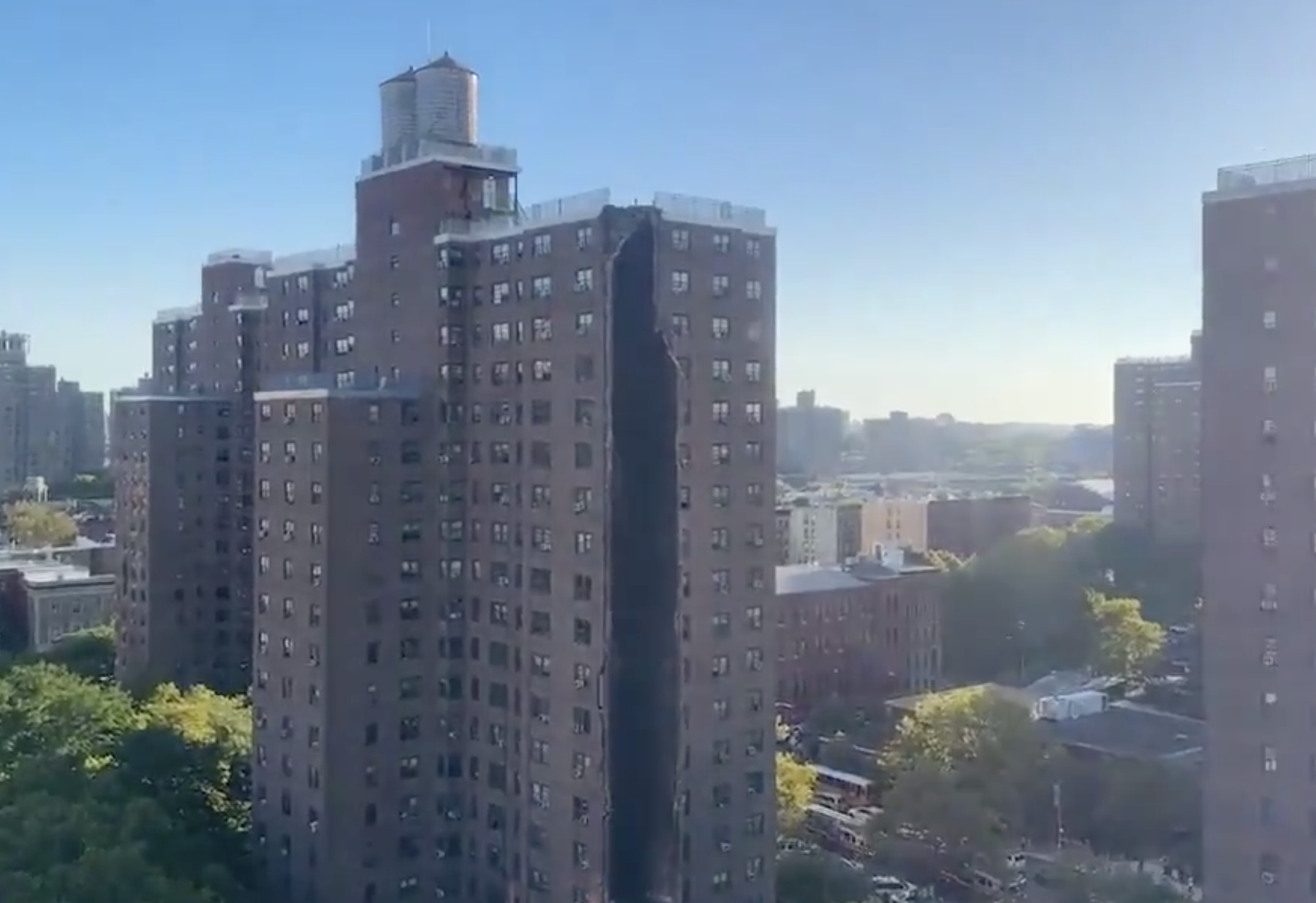 New York apartment building partially collapses in suspected gas explosion