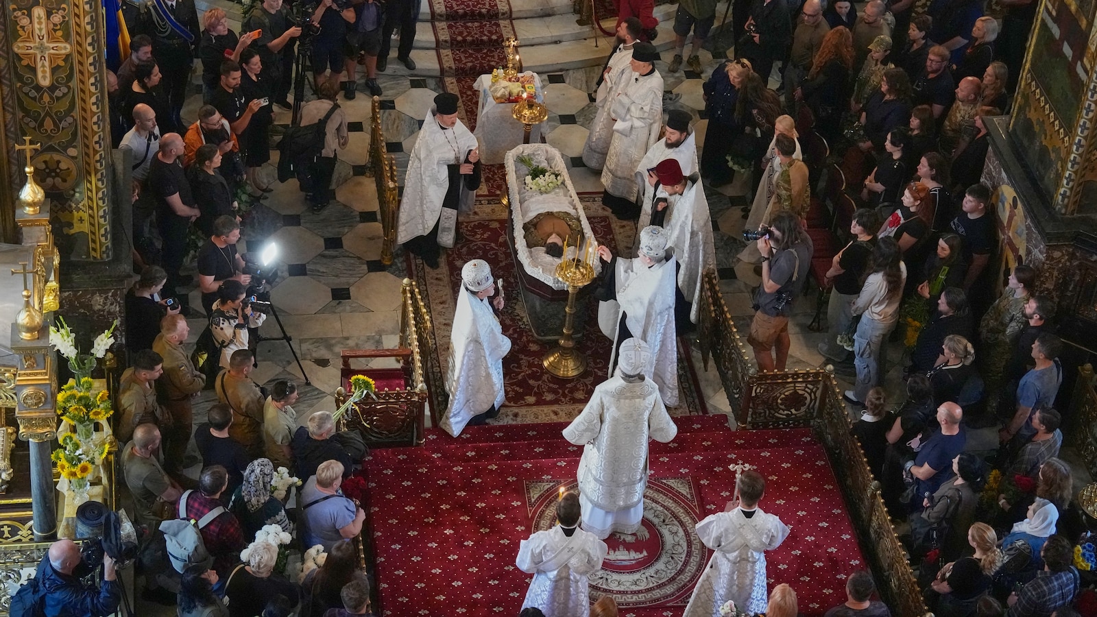 Ukraine honors 'collector of souls' killed while recovering the war dead