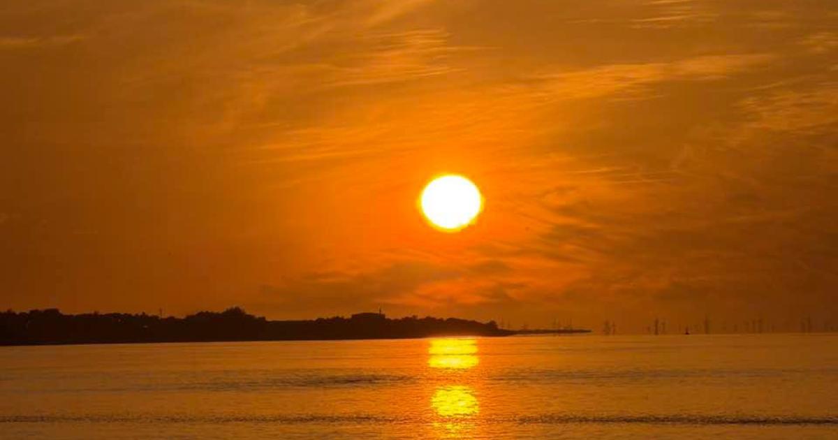 When will temperatures rise in Wrexham and Flintshire according to the Met Office?