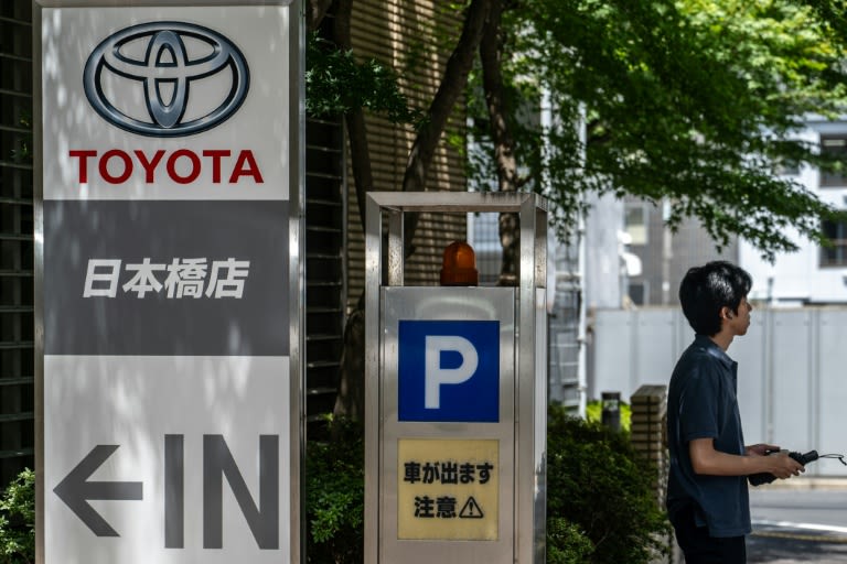 Weak yen helps auto giant Toyota raise forecasts