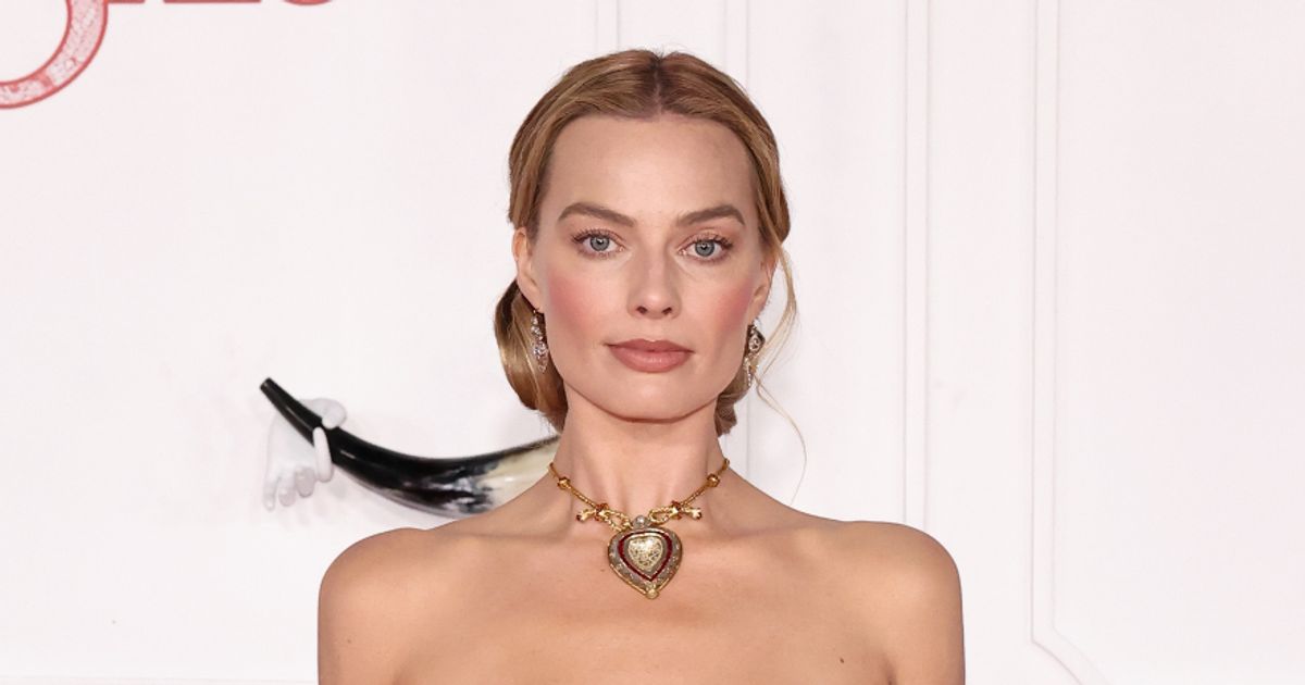Margot Robbie sizzles in plunging corset dress as she turns heads on red carpet