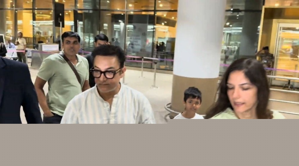 Aamir Khan returns to Mumbai with wife Gauri Spratt, stepson gets confused by paparazzi frenzy at airport