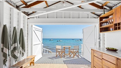 'Ultra rare' seaside boat shed hits the market for the same price as an average home - but there's a major catch if you want to snap it up