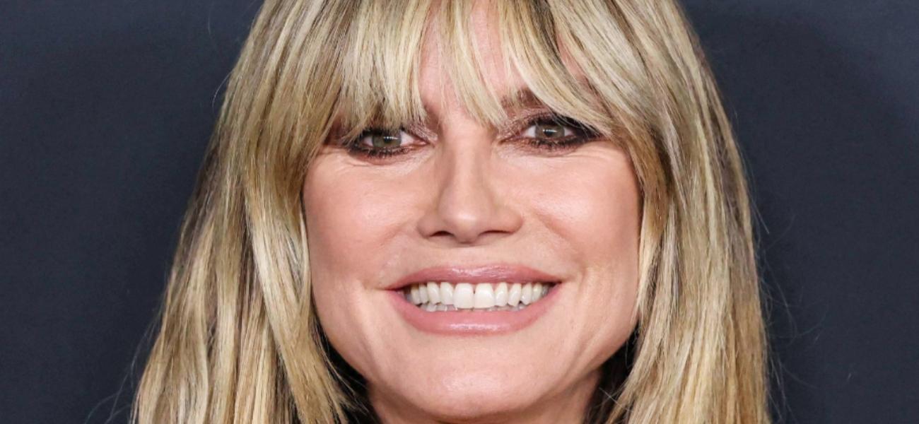 Heidi Klum Hangs Around Railway Tracks Shirtless In An Open Coat