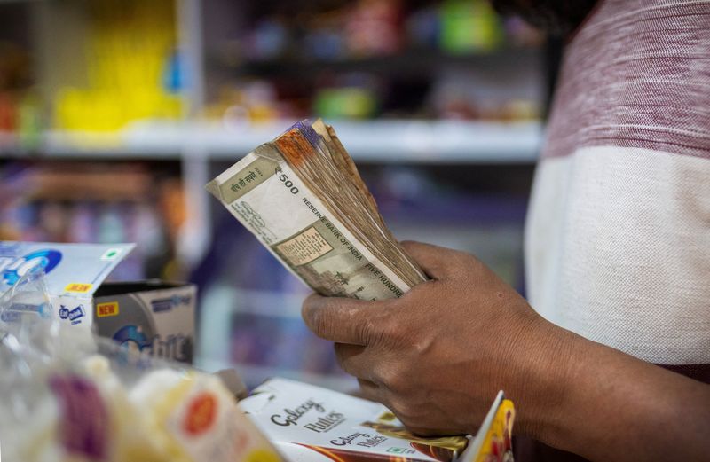Rupee drifts; RBI intervention dulls pinch from weak stocks, firm dollar
