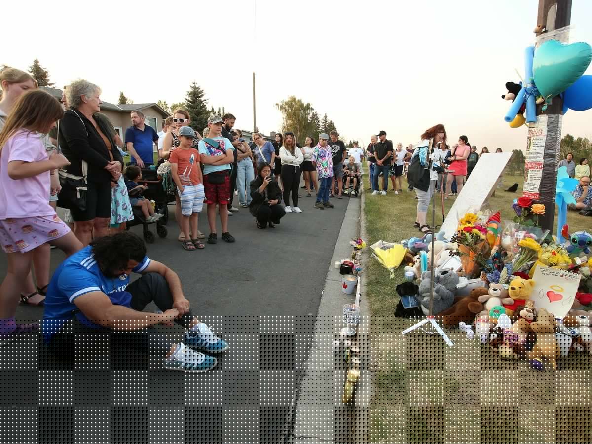 'Community that is like a big family': Vigil attendees mourn the loss of 11-year-old Parker