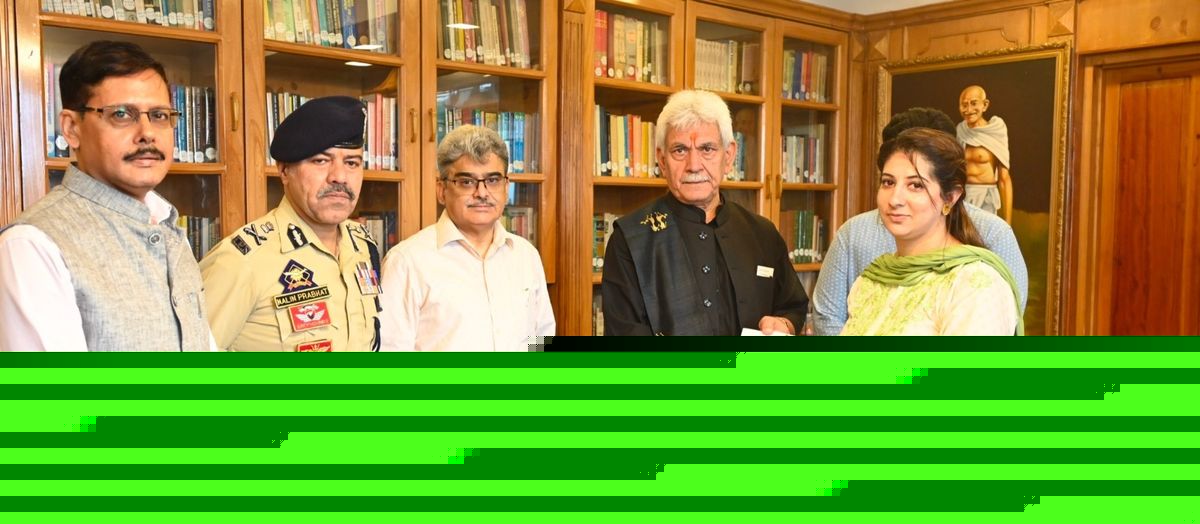 LG Sinha hands-over appointment letter to wife of J&K Police Inspector Masroor Ali Wani