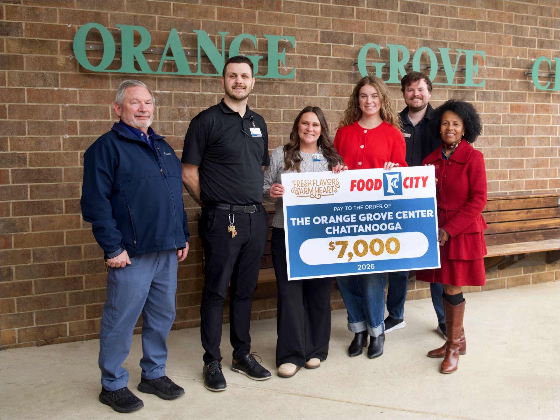 Food City Presents Check to The Orange Grove Center