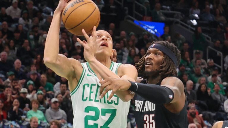 Jrue Holiday and Rob Williams return to Boston in stylish walk down memory lane
