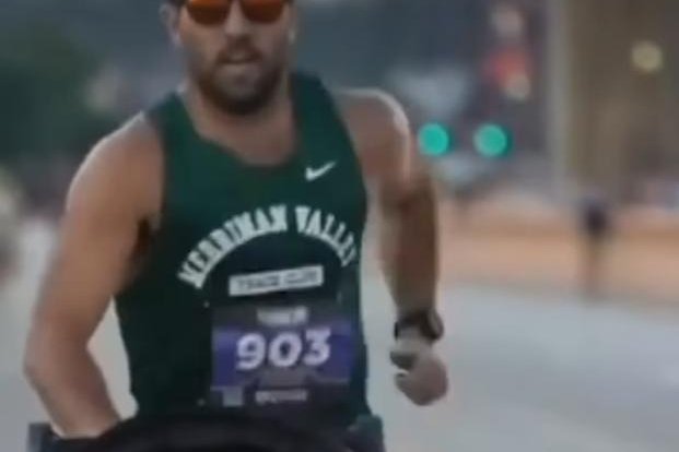 Watch: Dad unofficially breaks world record for running a mile with stroller
