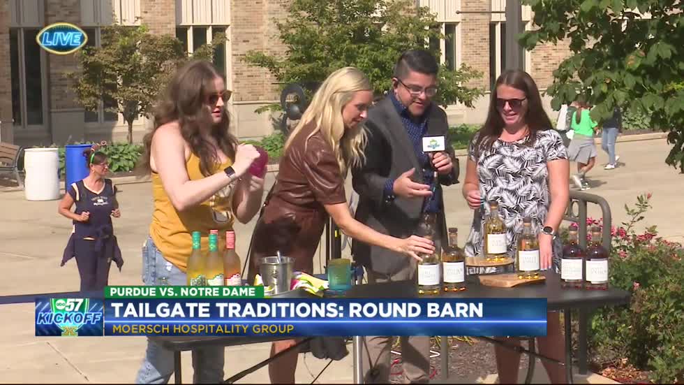 TAILGATE TRADITIONS: Round Barn staff stop by for a round