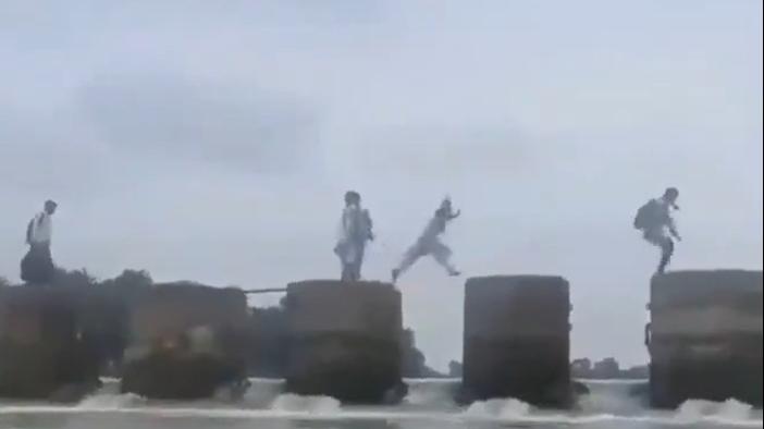 Children risk their lives jumping across dam pillars to reach school in MP; video sparks outrage
