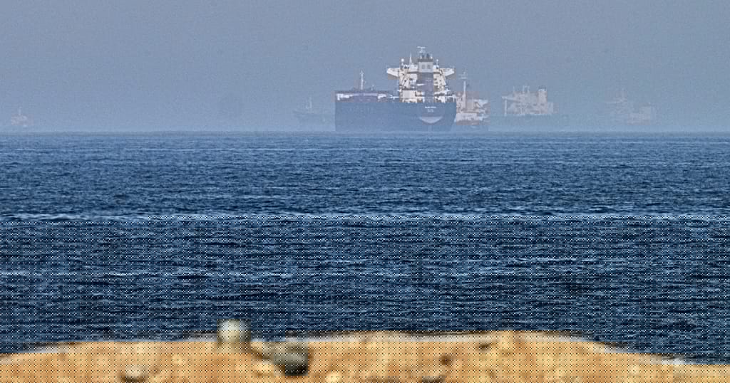 Cargo ship reports being struck as US, Iran claims about talks diverge
