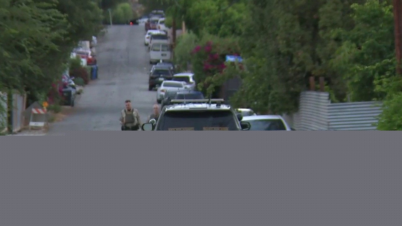 Armed suspect barricaded in Chatsworth home