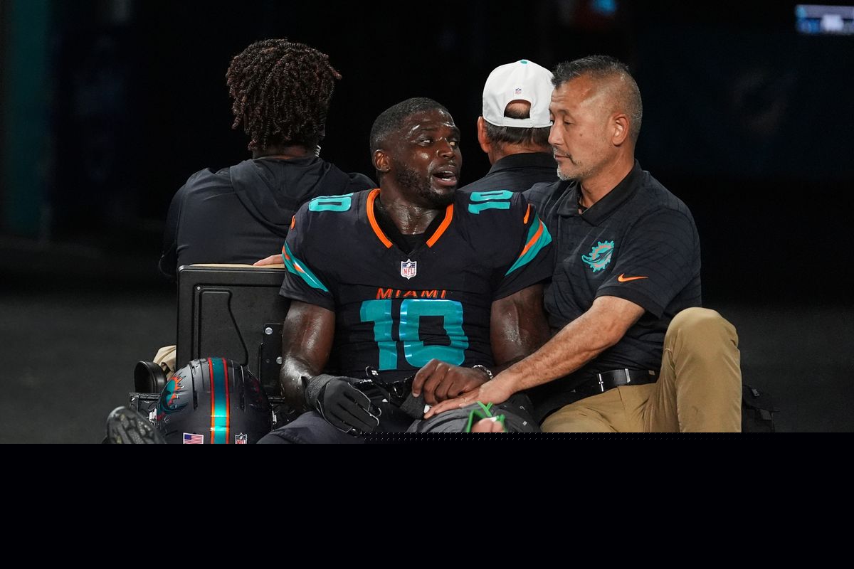 Dolphins' Tyreek Hill carted off field and taken to hospital with dislocated left knee
