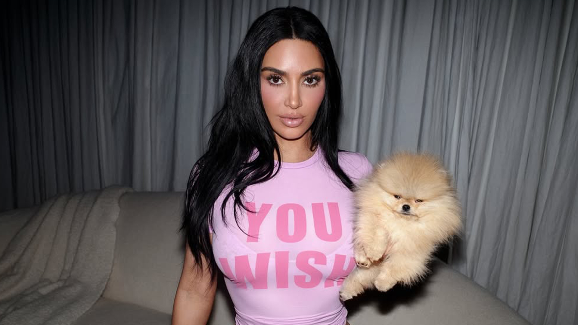 Kim Kardashian strips down to tiny white thong and crop top as she holds dog Sushi for sexy photoshoot
