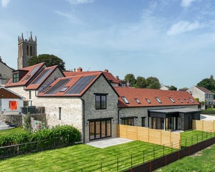 Homes with air source heat pumps or solar panels for sale in England – in pictures
