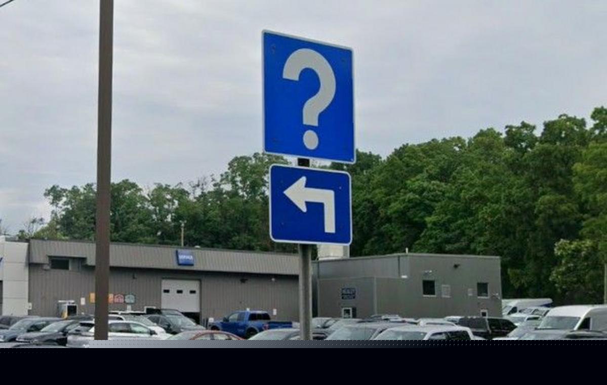 What Do Those Strange Blue Question Mark Road Signs Mean?