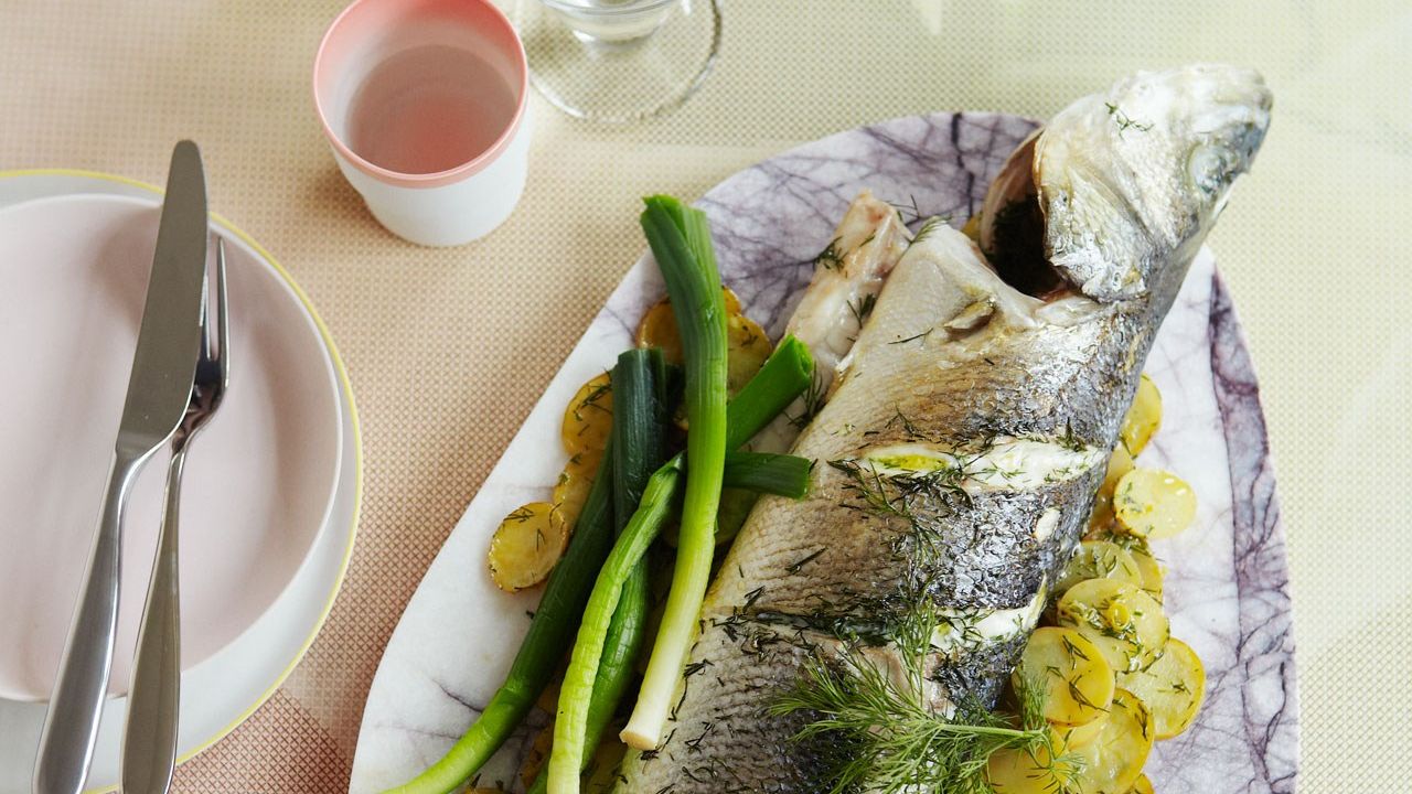 Baked sea bass with baby leeks, potatoes, raki and dill - Fish Recipes