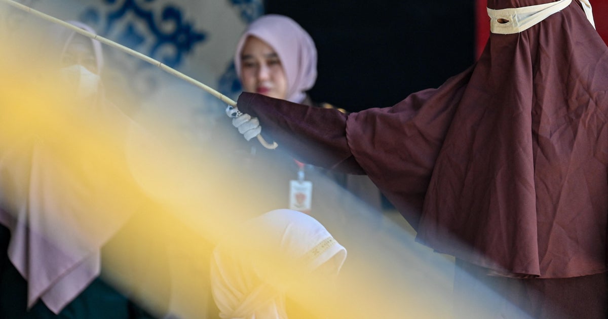 Indonesian couple caned for sex outside marriage and drinking alcohol