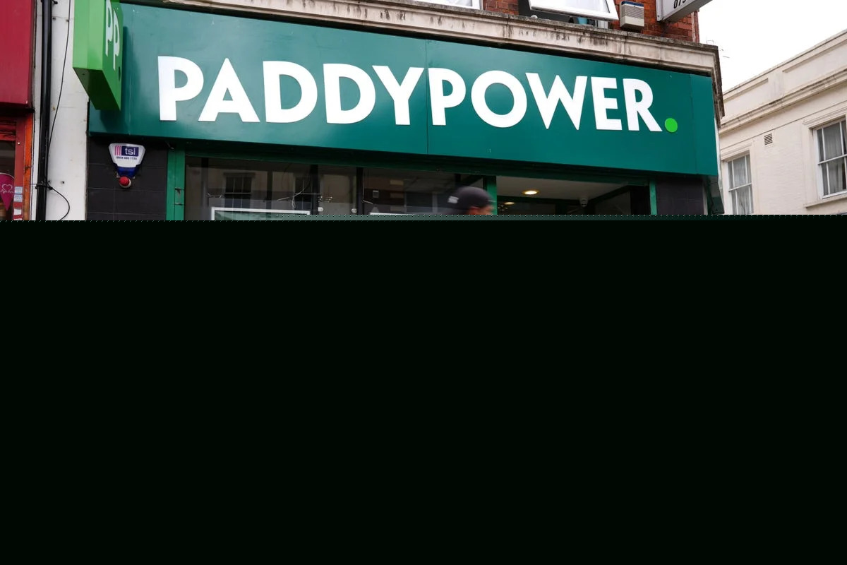 Boss of Paddy Power owner to step down after forecasts cut