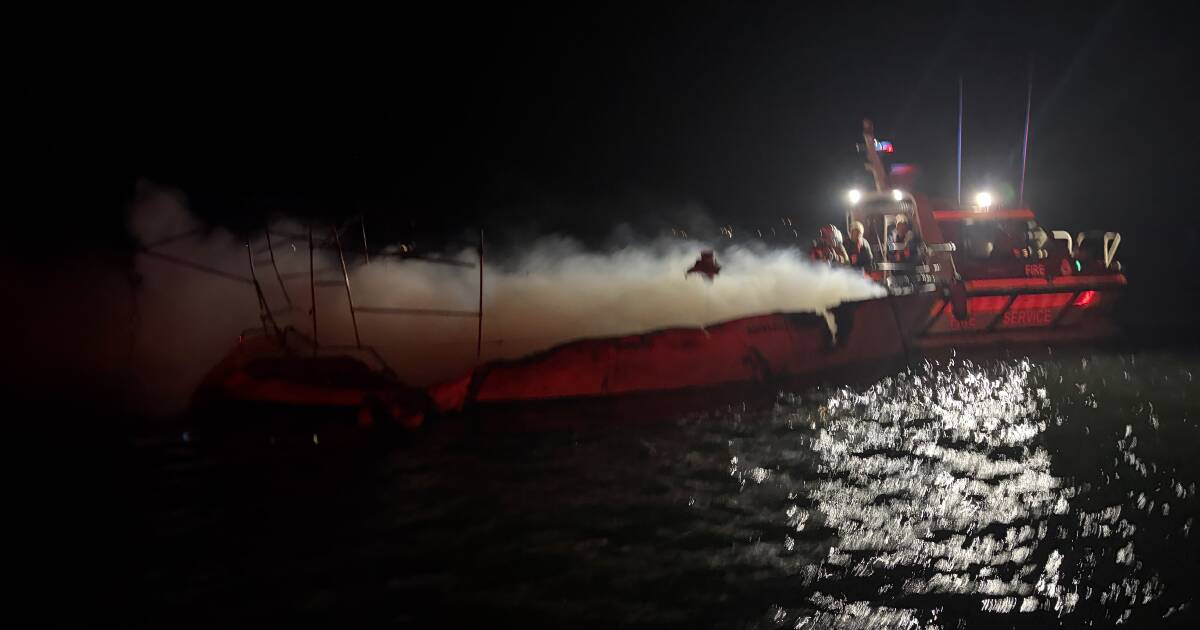 Man leaps overboard as yacht erupts in flames at Lake Macquarie