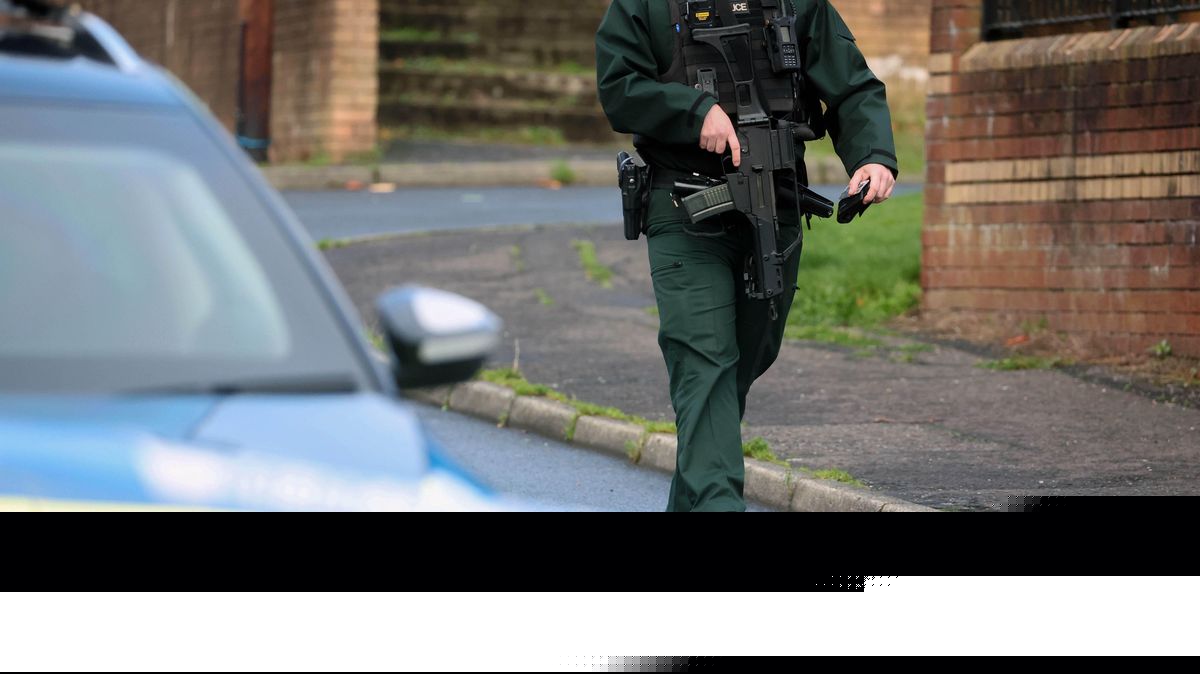 Police fire baton round as man barricades himself in property and 'throws items from a window'