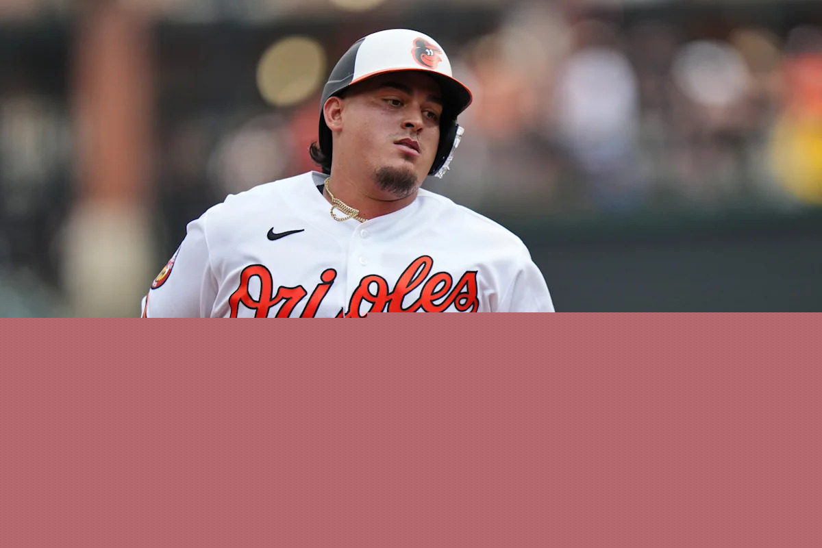 Orioles catcher Yohel Pozo gets hit in hand by Josh Bell's bat, leaves game
