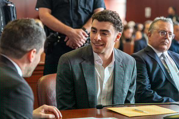 Luigi Mangione’s Gray Suit — and Slightly Unbuttoned Shirt — Draws Attention During NYC Court Appearance
