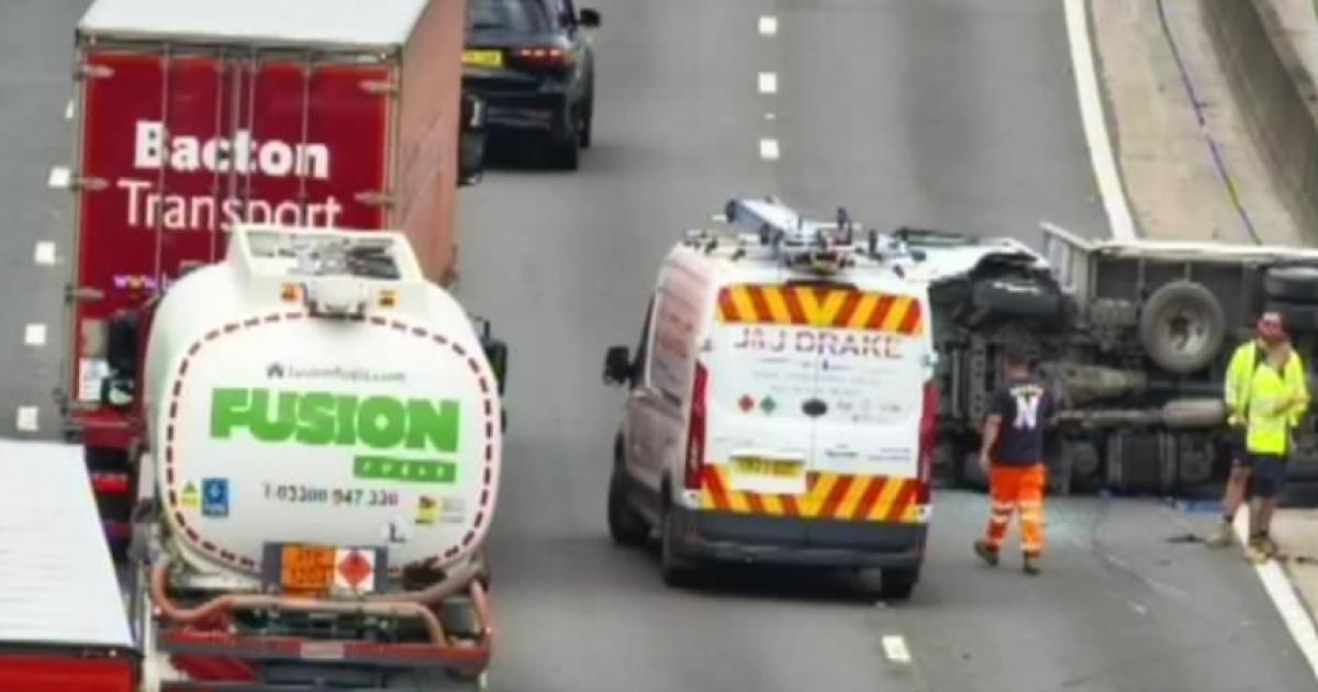 Truck ends up on side as crash causing severe delays on M25