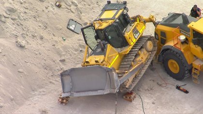 Worker killed after bulldozer rolls at cement site at Port of Brisbane