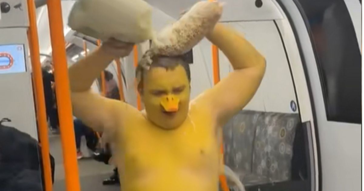 Man dressed as duck pours milk and cereal over himself on Glasgow Subway