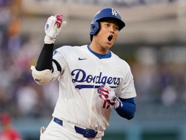 Ohtani hits 2 homers for Dodgers in playoff opener against Reds