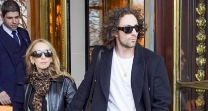 Aaron Taylor-Johnson & Wife Sam Hold Hands as They Check Out of Paris Hotel