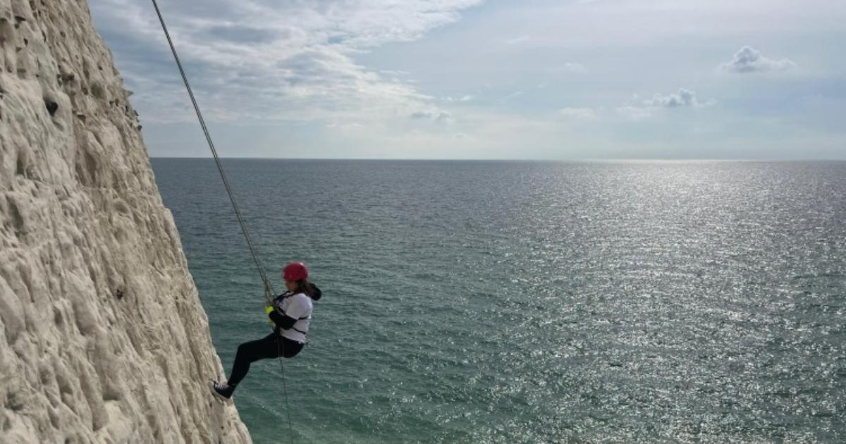 Eastbourne care home manager abseils cliff for animal rescue charity