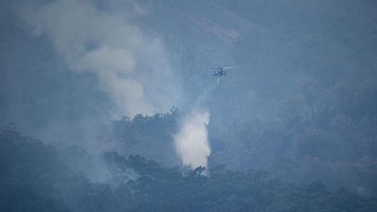 Bushfire could 'run again' amid dry conditions