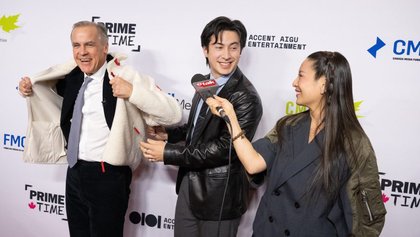 ‘Heated Rivalry’ Star Hudson Williams Helps Canadian Prime Minister Mark Carney Into A Fleece At Ottawa Gala