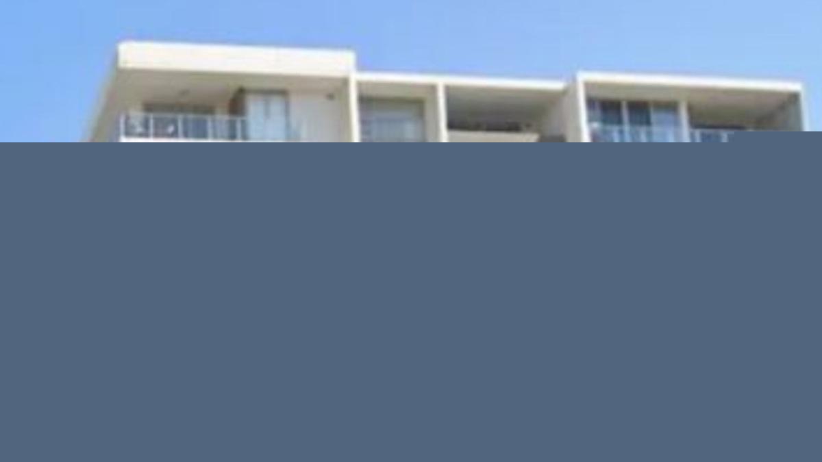 A woman has died after falling from an apartment balcony in Wollongong