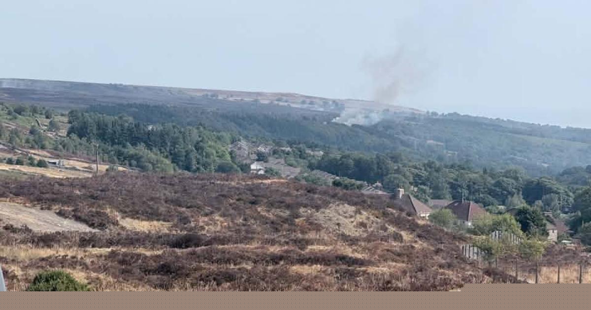Firefighting helicopter deployed as crews battle wildfire burning near homes